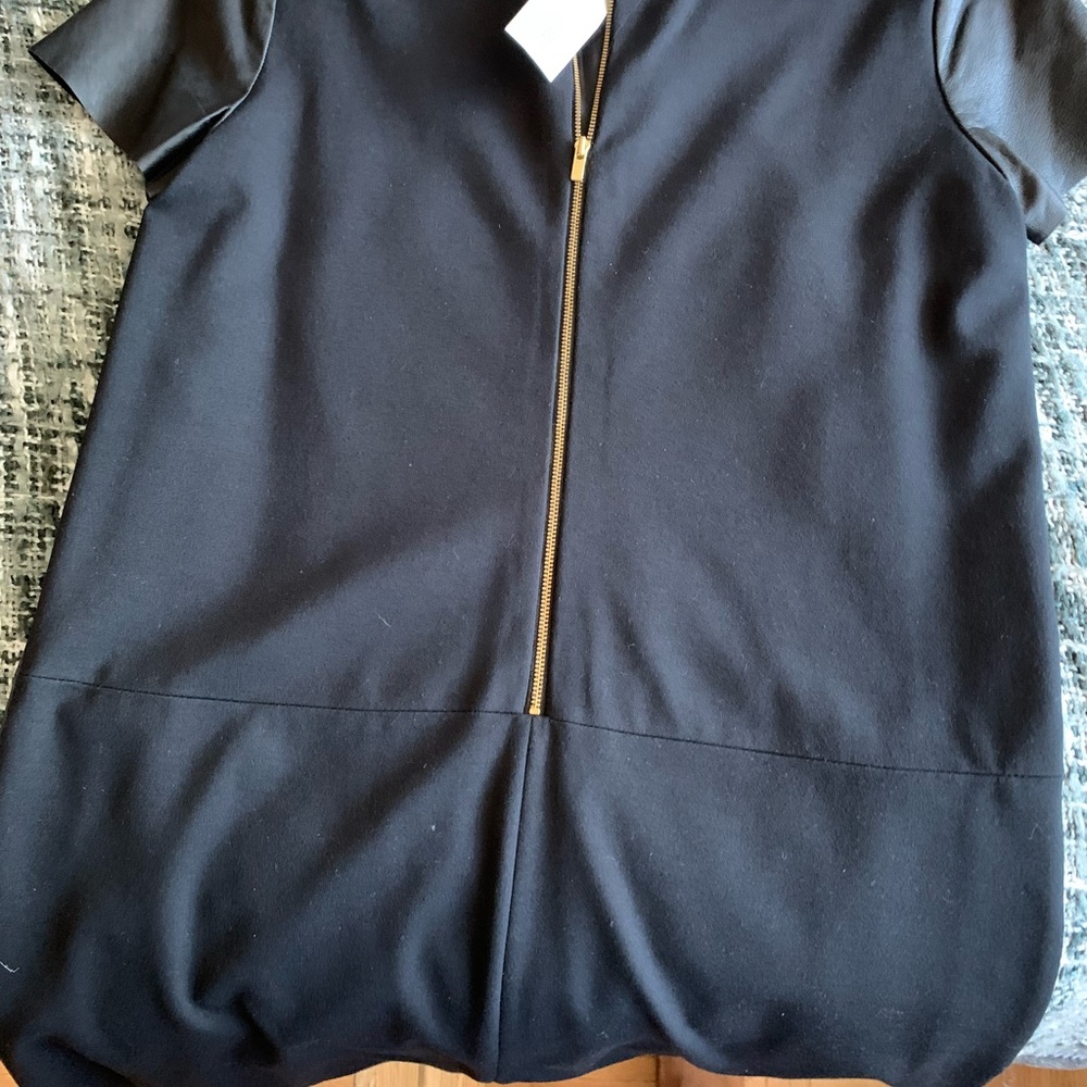 Leather Dress  with pockets .. Leather in the front and spandex in the Back